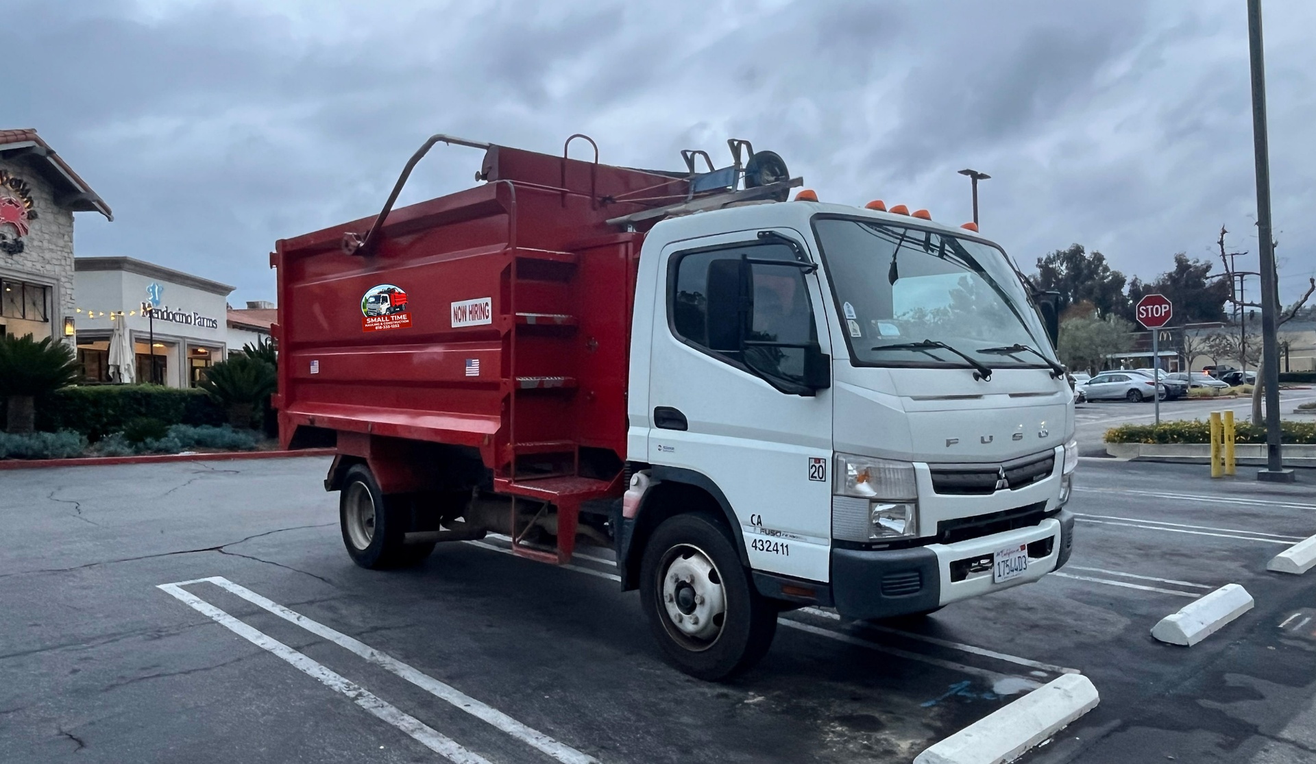 Small Time Hauling truck loaded for junk removal service